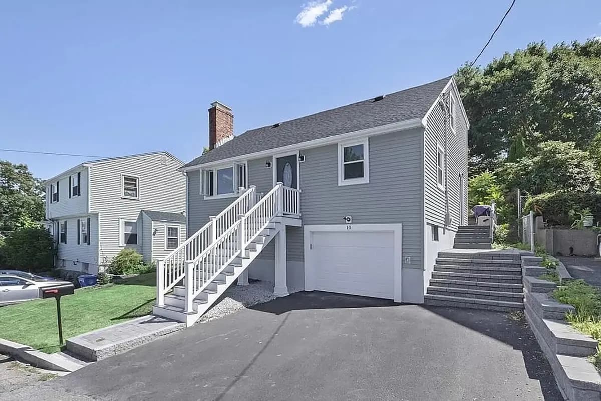 Renovated Waltham home on Mount Vernon Avenue with gray siding, white trim, and attached garage
