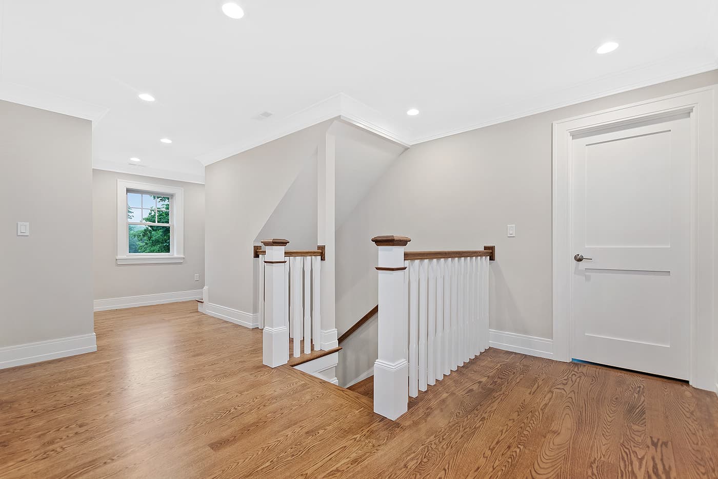 Finished attic space with dormer windows, built-in window seats, and recessed lighting, Garland Rd., Newton.
