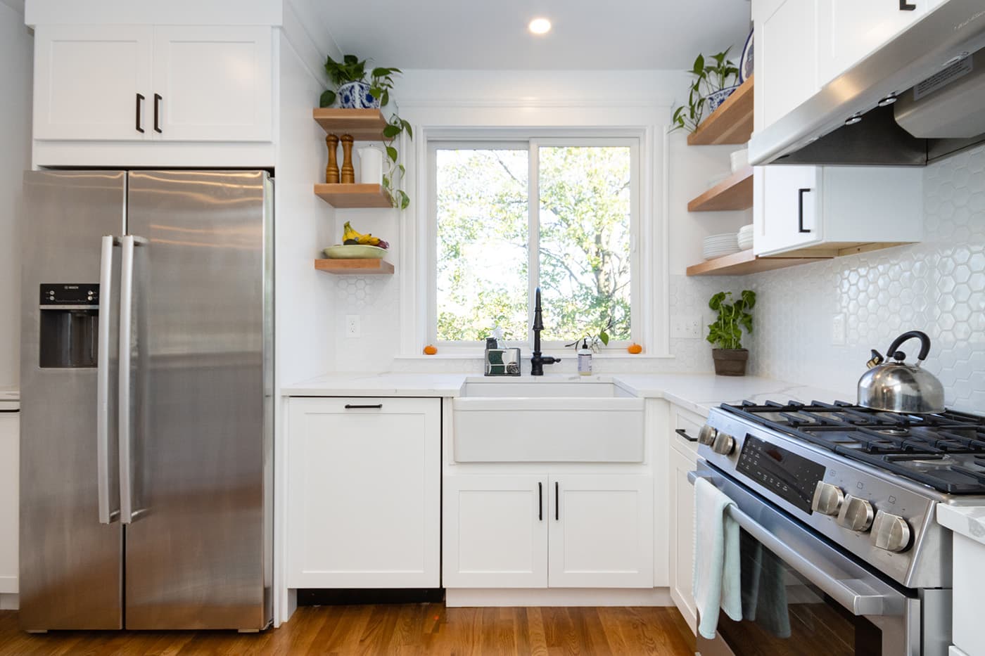 N Crescent Circuit Boston kitchen farmhouse sink with black faucet, wood shelving, and hex tile backsplash