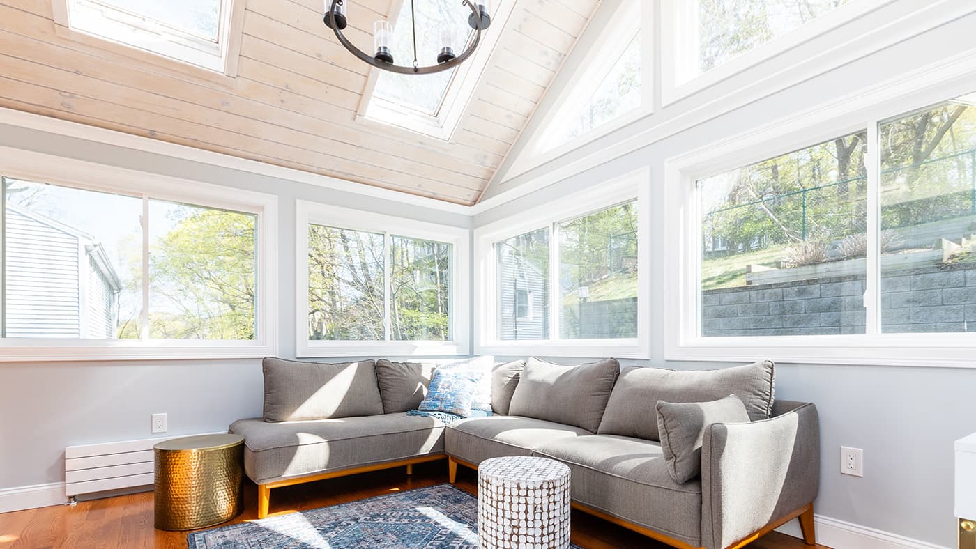 Inside the sunroom addition on Newtonville Ave. in Newton, with a vaulted ceiling, skylights and walls of windows