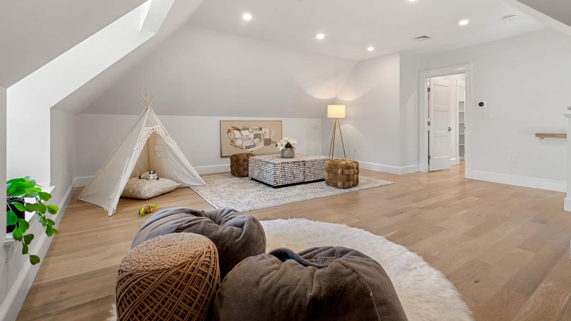 Sewall St. Newton attic remodel with playroom teepee nook, skylight, and wide plank floors