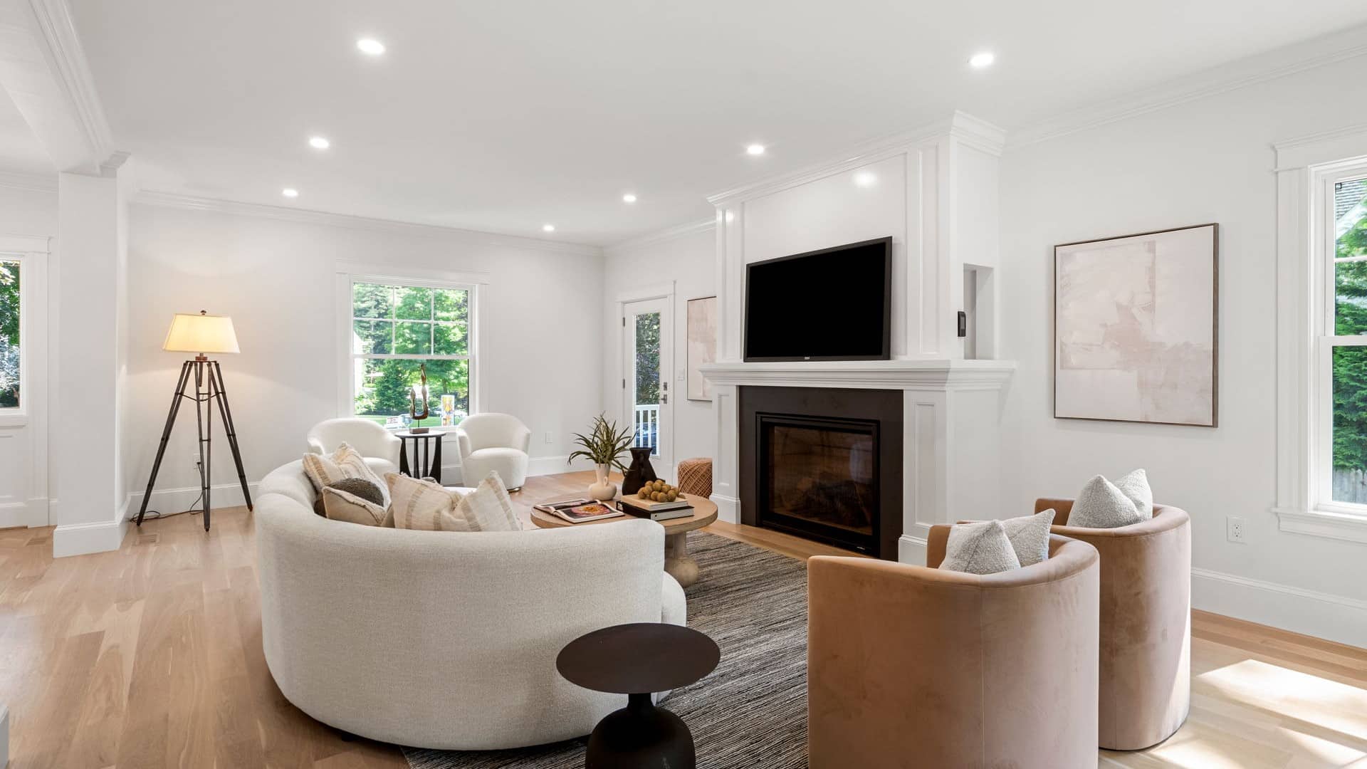 Sewall St. Newton living room remodel with a white fireplace surround and refinished oak floors