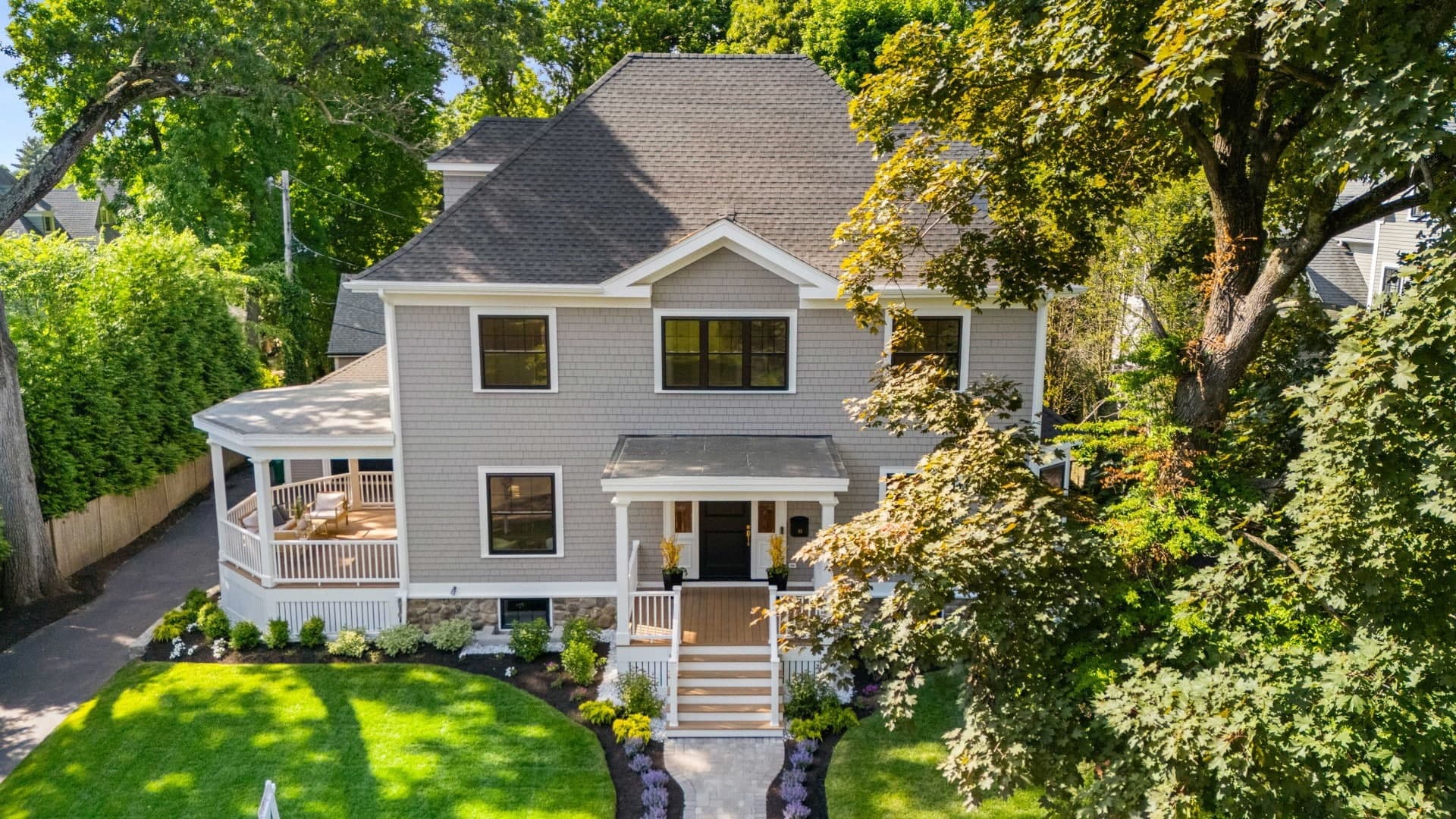 Whole house remodel on Sewall St. in Newton, a gray shingled home with a wraparound porch seen from above