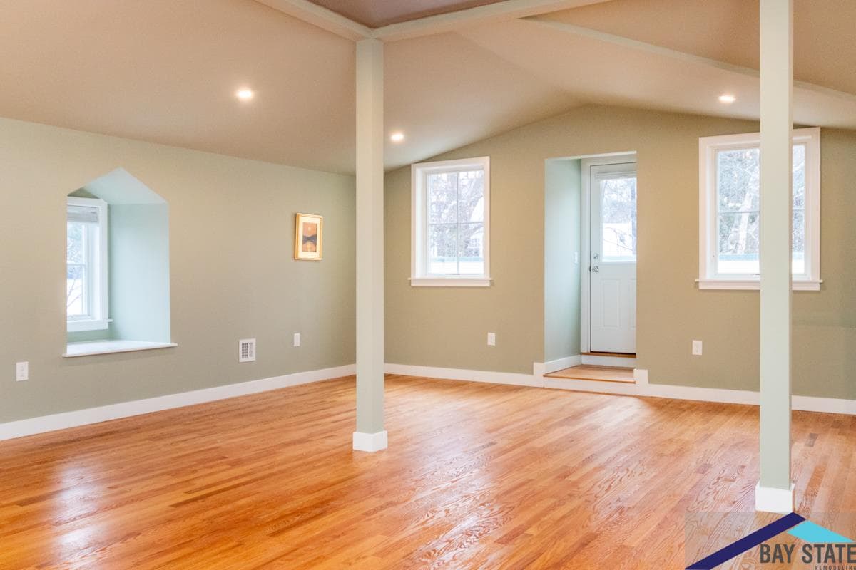Highland St. Newton attic remodel featuring vaulted ceiling, dormer window seat, and hardwood floors
