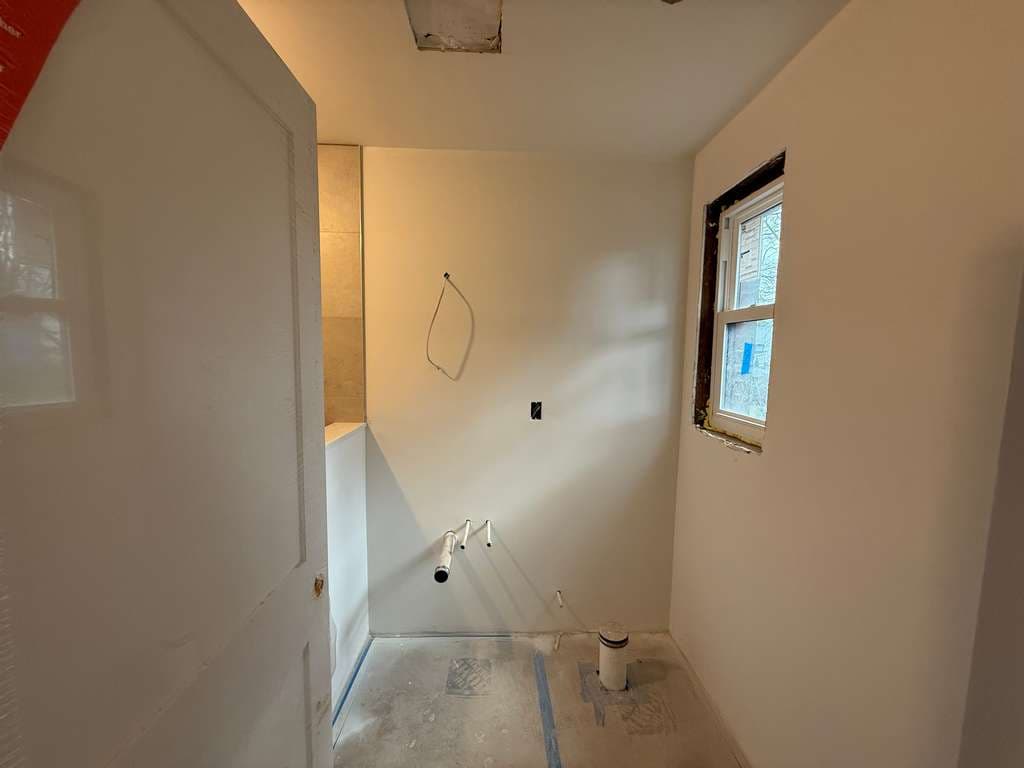 Bathroom work in progress during the Windermere Rd. whole-house remodel in Newton