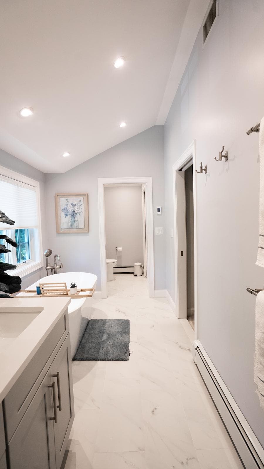 Renovated Wayland bathroom on Brook Trail Rd. with freestanding soaking tub and gray double vanity
