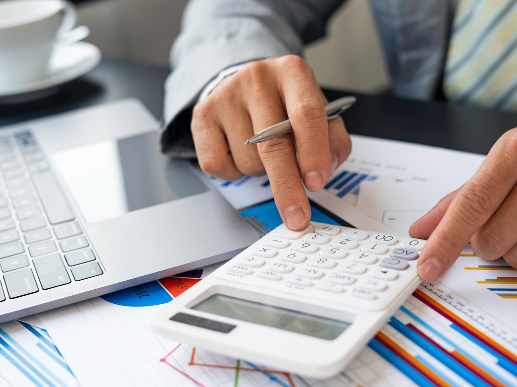 male finance staff calculating