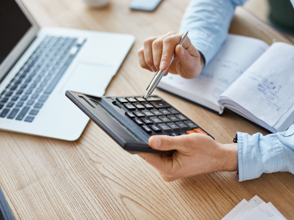 finance manager holding calculator