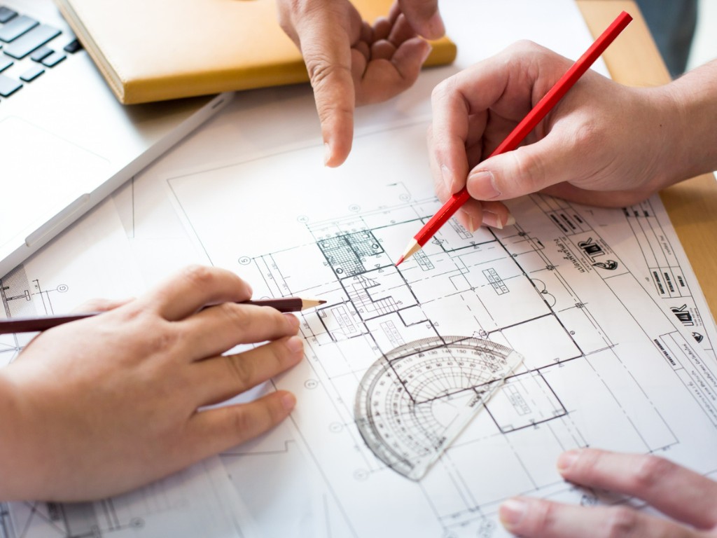 architects discussing table with close up hands