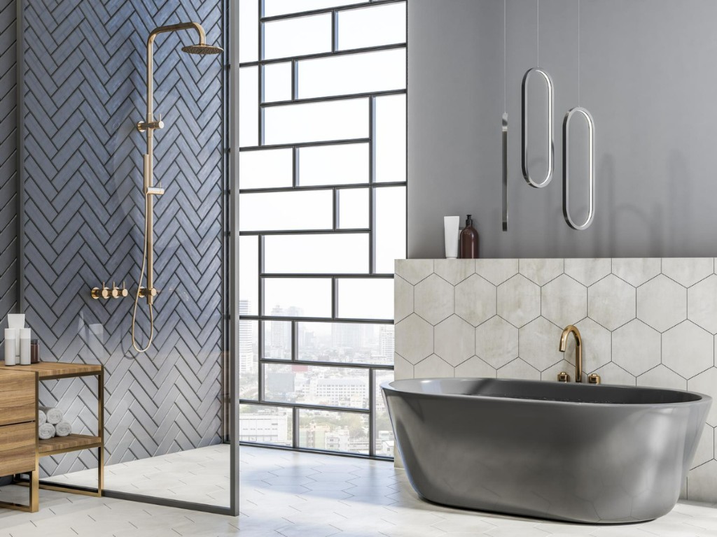 stylish light bathroom with grey herringbone ceramic tale wall