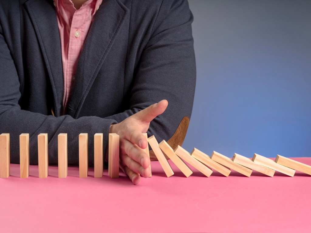 wooden-blocks-falling-representing-economy