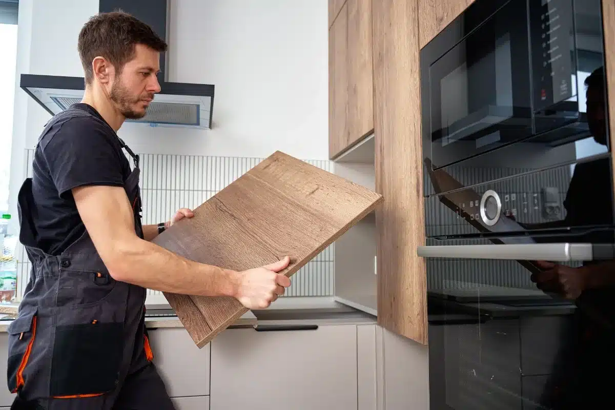 Kitchen remodeling cost breakdown for MA homeowners: cabinet panel fitting