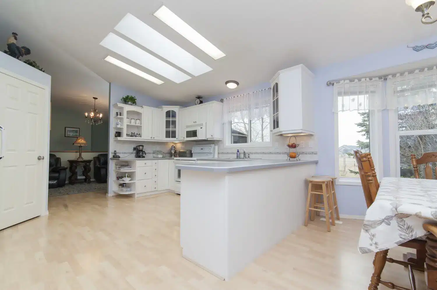 Updated white kitchen showing cost effective upgrades that add most value for kitchen remodel ROI