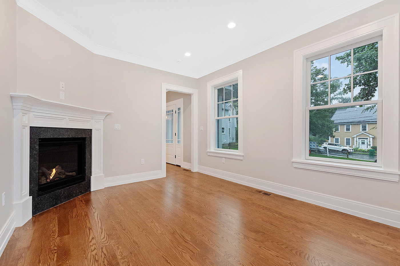 Completed living-room flooring, windows and recessed lighting at the Garland Road whole-home expansion, a project that included a new foundation and second-story addition.